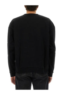 Obey men’s black cotton oversized crewneck sweatshirt with relaxed fit and ribbed cuffs