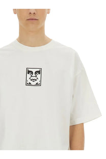 White cotton t-shirt with black and white stylized face graphic on chest from obey men’s icon face shirt white collection