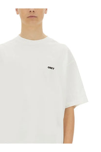 Obey men’s icon face white t-shirt with small black embroidered logo on left chest in cotton material