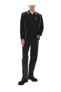 Obey men’s black long-sleeved polo shirt with white piping and chest logo, paired with hardwork black pants