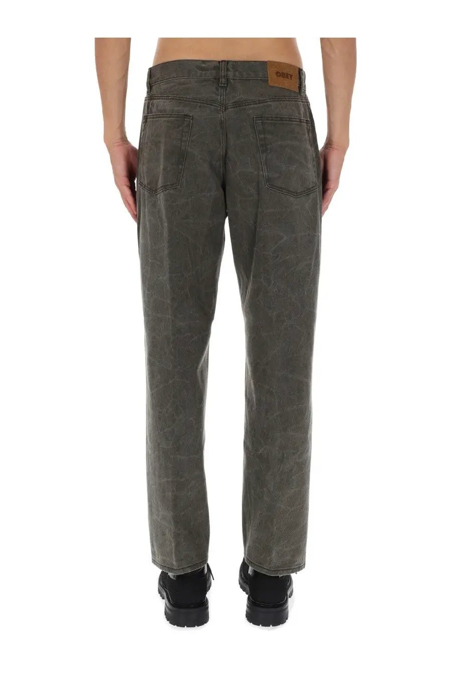 Obey men’s dark gray denim jeans with faded distressed finish and brown leather brand patch at the waistband back side