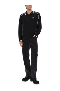 Obey men’s black long-sleeved polo shirt with white piping on collar sleeves and cuffs in cotton material