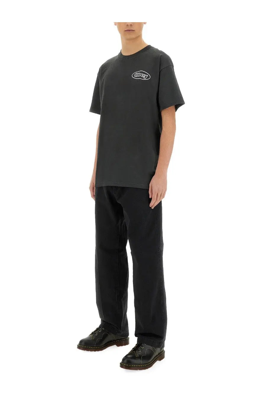 Obey men’s reaction black short-sleeved t-shirt featuring a white oval logo on the chest in cotton material