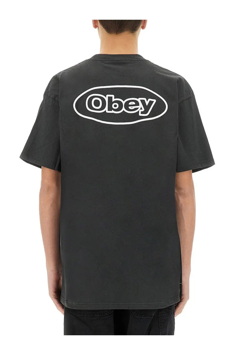 Back side of obey men’s reaction black t-shirt featuring a white oval logo for casual wear