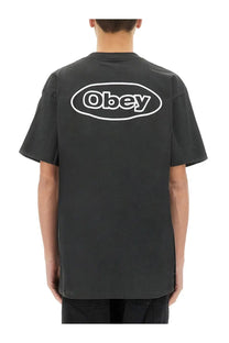Back side of obey men’s reaction black t-shirt featuring a white oval logo for casual wear