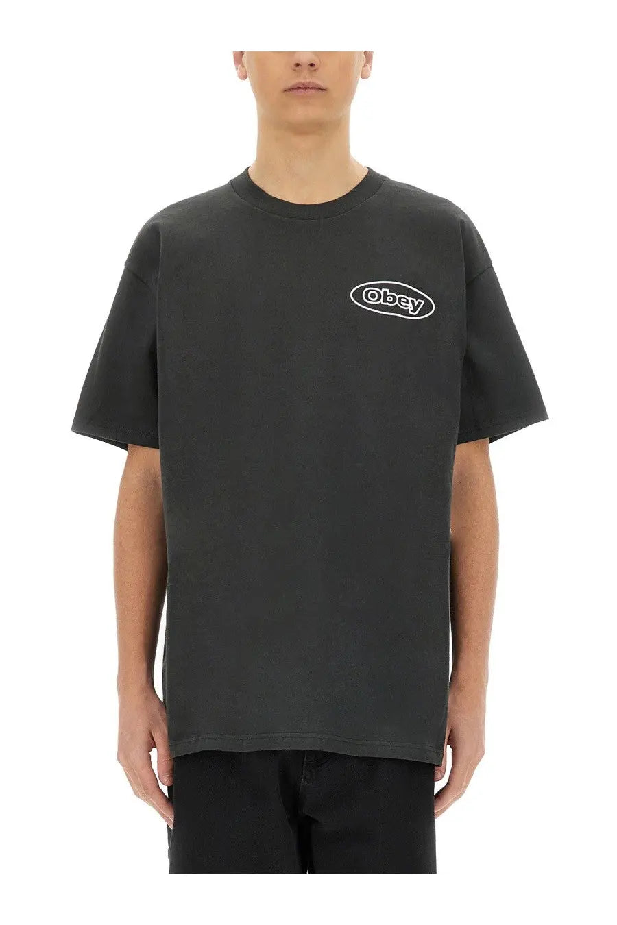 Obey men’s reaction shirt black with white oval logo on chest made of comfortable cotton material