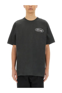 Obey men’s reaction shirt black with white oval logo on chest made of comfortable cotton material