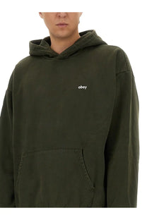 Obey men’s olive green hoodie with subtle white embroidered logo on chest perfect for casual wear