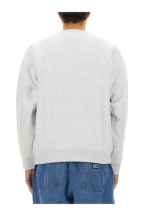 Obey men’s heather gray crewneck sweatshirt showing the back with a small black and white logo patch on lower back