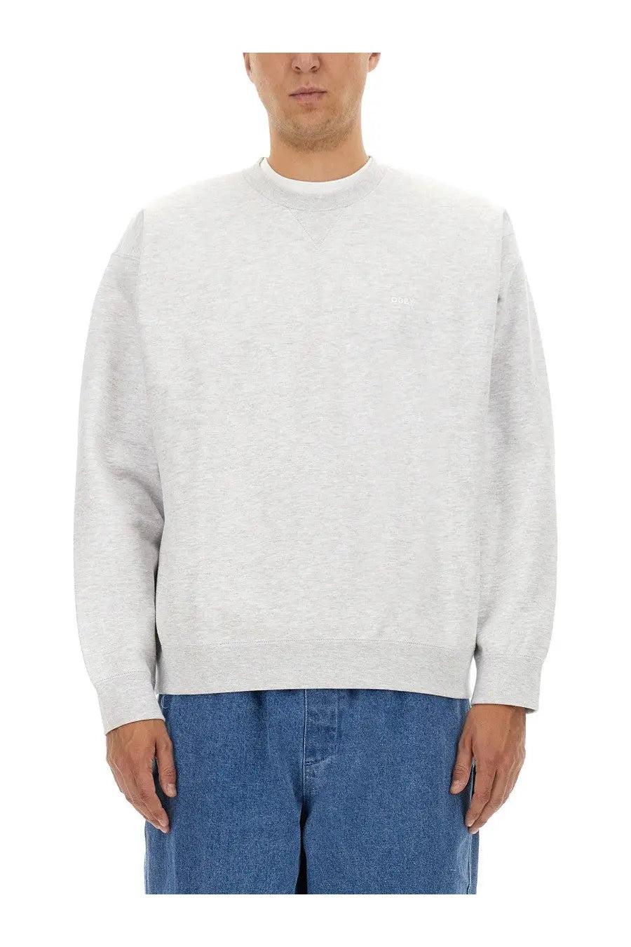 Obey men’s heather gray crewneck sweatshirt with subtle embroidered logo on left chest in soft cotton blend