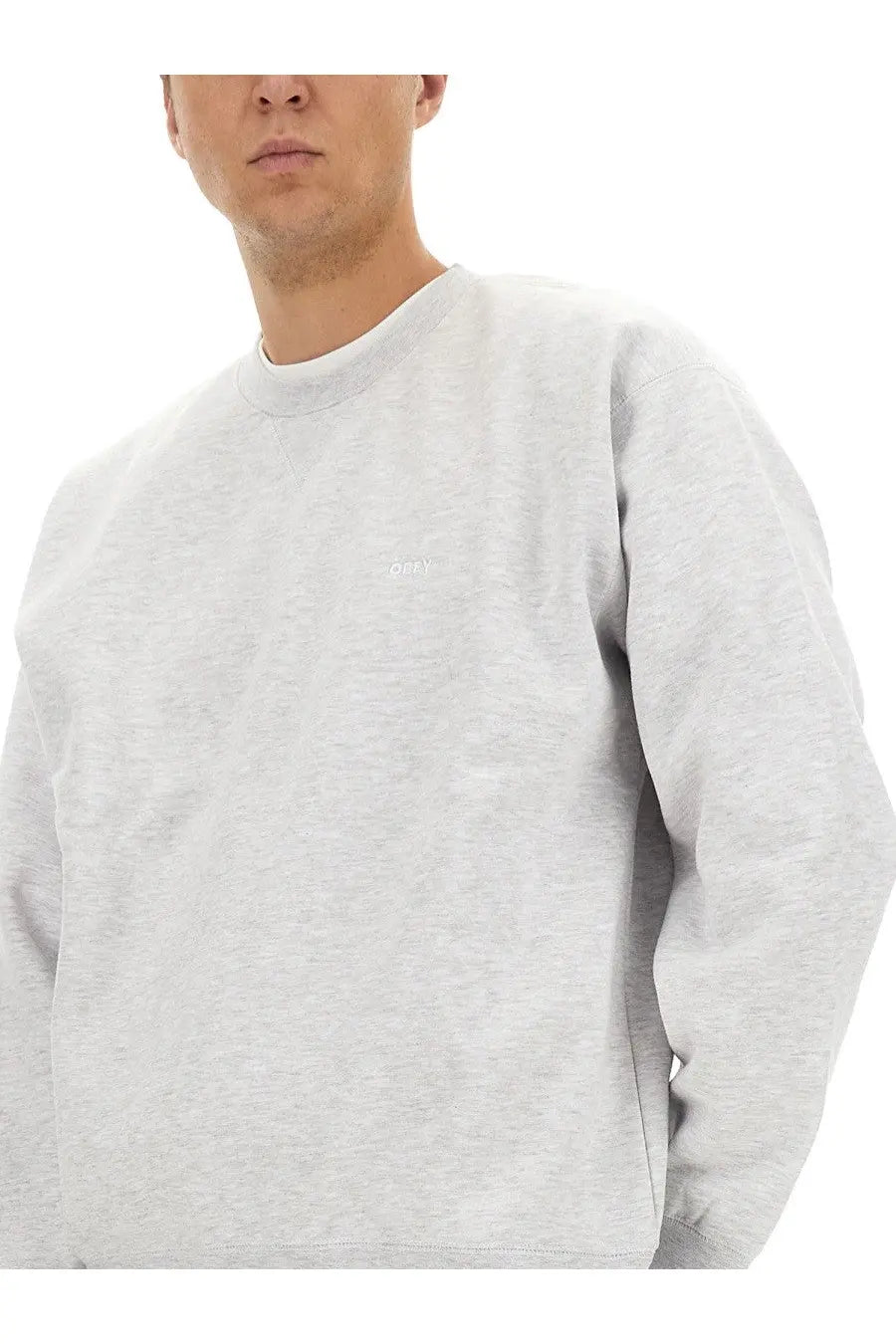 Obey men’s heather gray crewneck sweatshirt with small embroidered logo on left chest, comfortable casual wear