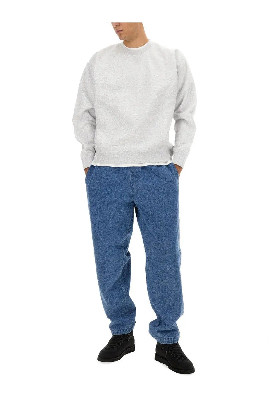 Light blue relaxed fit denim jeans with subtle texture paired with obey men’s grey sweatshirt front view