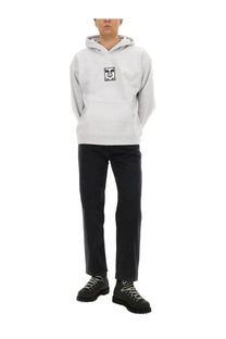 Obey men’s light gray hoodie with a black and white graphic expressive face on the chest in cotton material