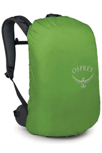 Green osprey rain cover with subtle white logo shown on the back of the osprey unisex zaino hikelite black backpack
