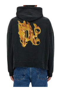 Black hoodie featuring palm angels men’s burning monogram flame logo in orange and yellow on the back