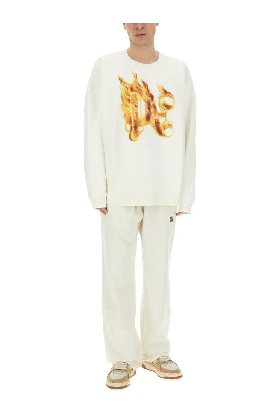 Off-white long-sleeved Palm Angels sweatshirt with a bold golden-orange flame monogram print on the chest