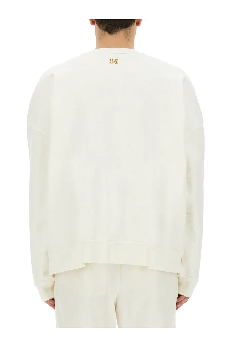 Palm Angels men’s white oversized sweatshirt with subtle gold embroidered logo at the neckline