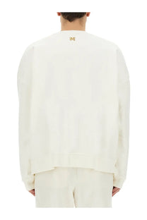 Palm Angels men’s white oversized sweatshirt with subtle gold embroidered logo at the neckline