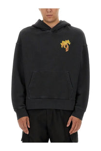 Palm Angels men’s black hoodie with gold and orange embroidered palm tree on the chest in cotton material