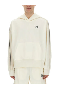 Cream-colored palm angels men’s monogram sweatshirt with black sleeve piping and small chest embroidered logo
