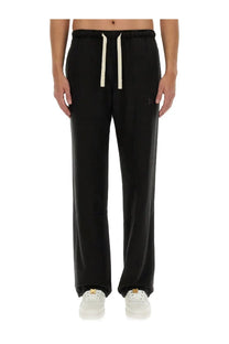 Palm Angels men’s black drawstring sweatpants with subtle embroidered logo on thigh and cream contrast drawstrings