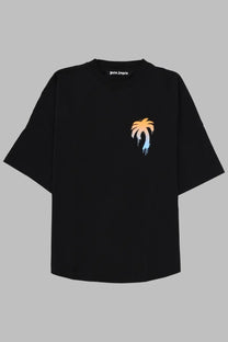 Black palm angels men’s shirt in cotone black featuring a gradient orange and blue palm tree graphic on front
