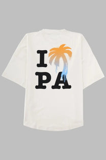 Back of white palm angels men shirt in cotone with black i pa lettering and orange to blue gradient palm tree graphic