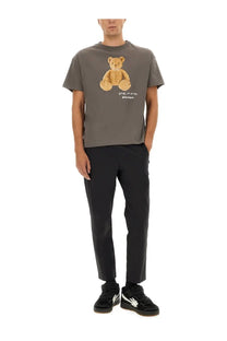 Gray short-sleeved cotton t-shirt by palm angels with tan embroidered bear graphic and bear in mind text