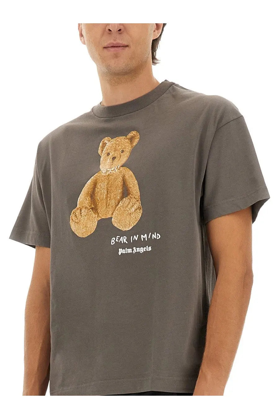 Palm Angels men’s grey t shirt with textured gold bear graphic and bear in mind palm angels text printed below