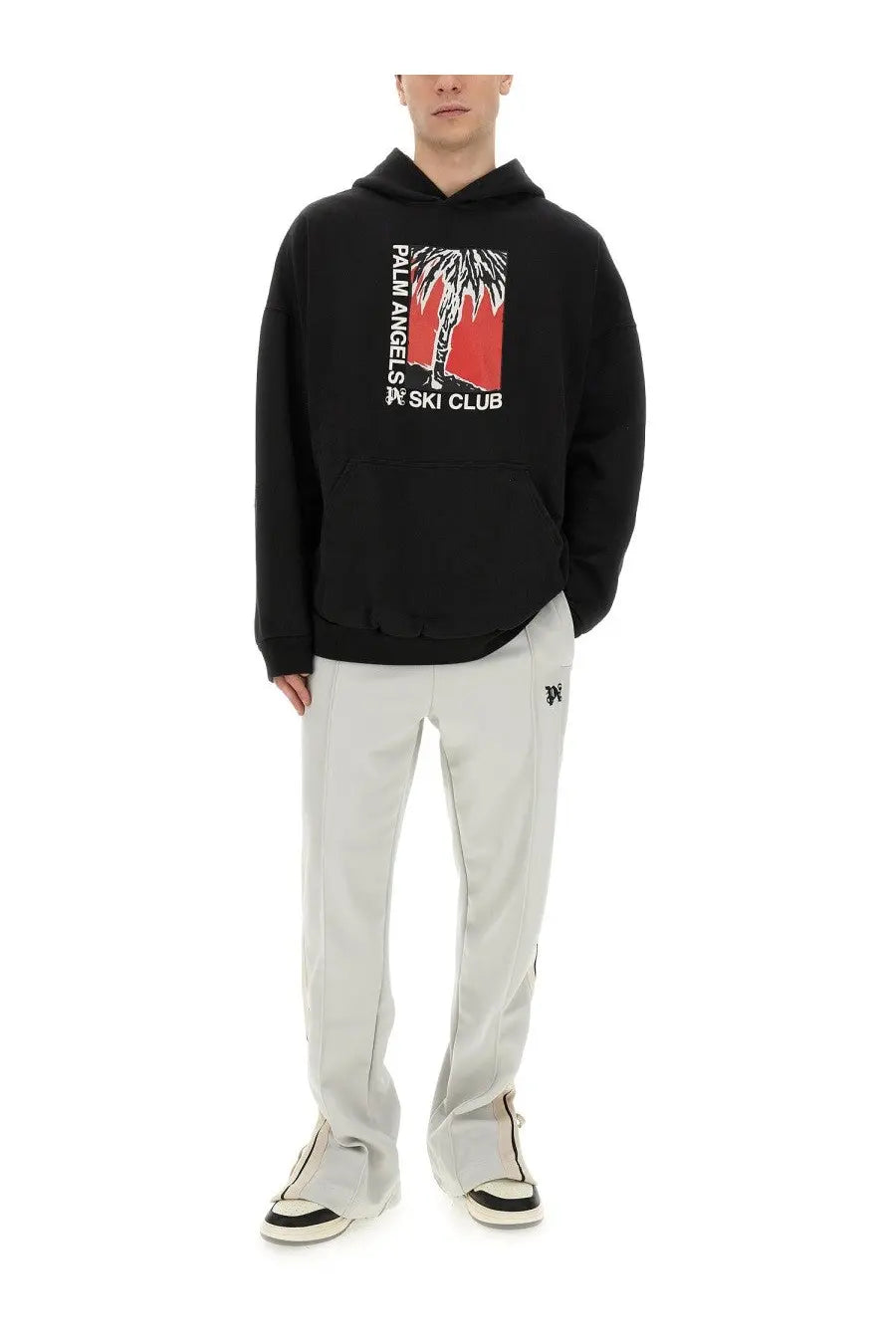 Black palm angels men’s hoodie with bold red and white palm tree graphic and ski club text on the front