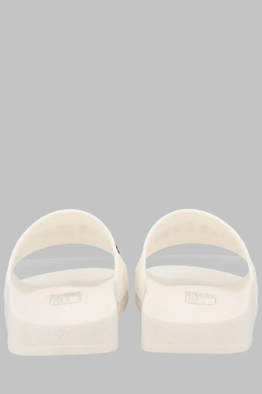Cream-colored palm angels men slide sandals with minimalist design and subtle insole branding in rubber material