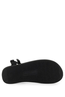 Black rubber sole with wavy tread pattern and rectangular patch on back side of palm angels men’s suicoke sandal black