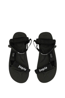 Black palm angels men’s suicoke sandals with white embroidered branding on black straps made of durable material