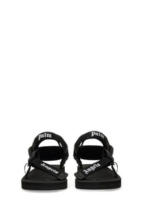 Black palm angels mens suede palm angels suicoke sandals with white lettering on straps front view