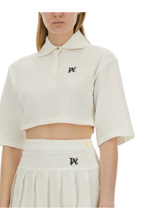 Palm Angels women’s cream-colored cropped polo shirt with short sleeves and black embroidered logos on chest and waistband