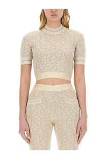 Beige cropped knit top with short sleeves and high neckline featuring subtle palm angels monogram pattern
