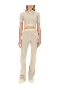 Beige patterned knit two-piece set with cropped top and flared pants from palm angels women’s monogram jersey white collection