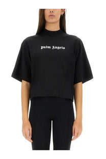 Black Palm Angels women’s cropped t-shirt with short wide sleeves high neckline and white lettering across the chest