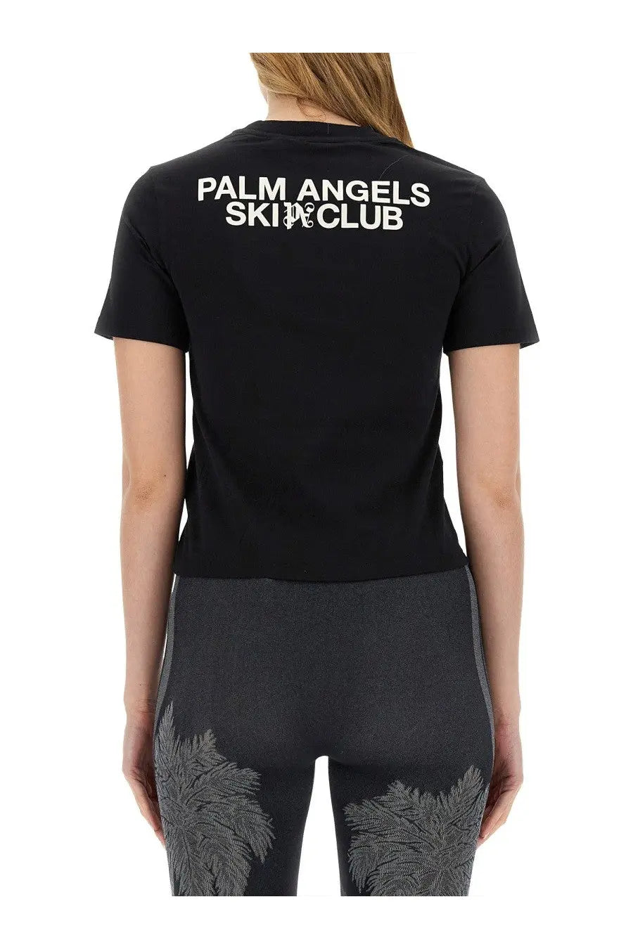 Black palm angels women’s short-sleeved shirt showing back with white palm angels ski club lettering