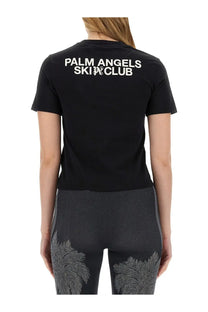 Black palm angels women’s short-sleeved shirt showing back with white palm angels ski club lettering