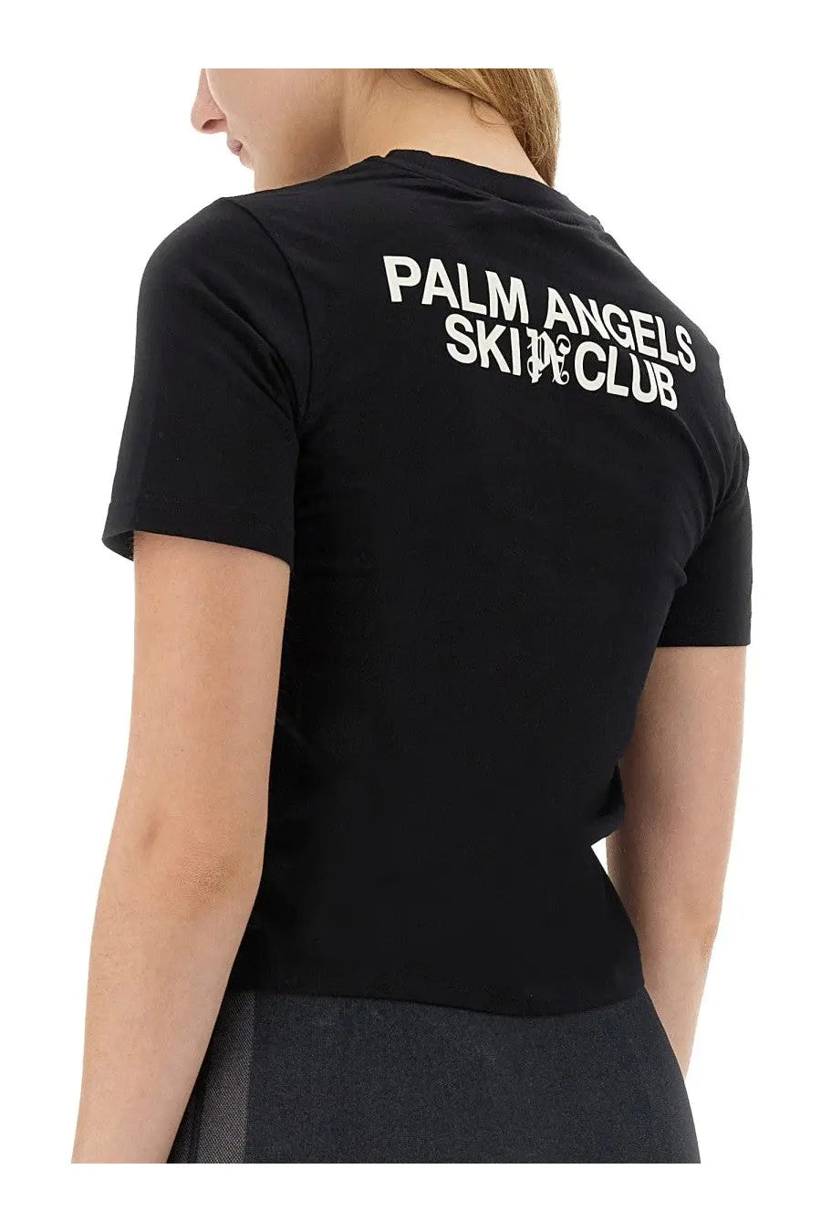 Back of black palm angels women’s short-sleeved t-shirt with white palm angels skin club lettering