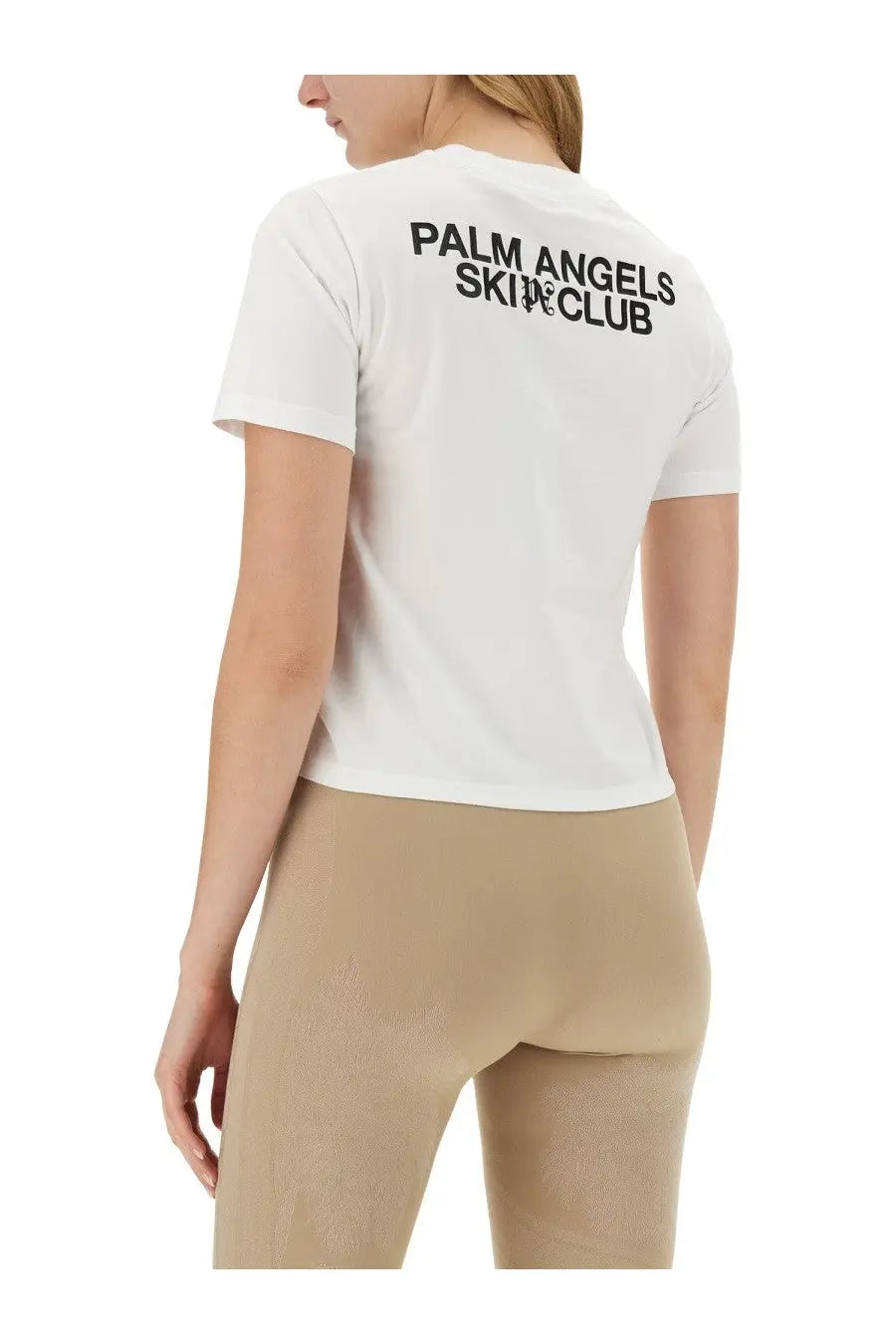 Back view of palm angels women’s white ski club short-sleeve t-shirt with black printed text on cotton fabric