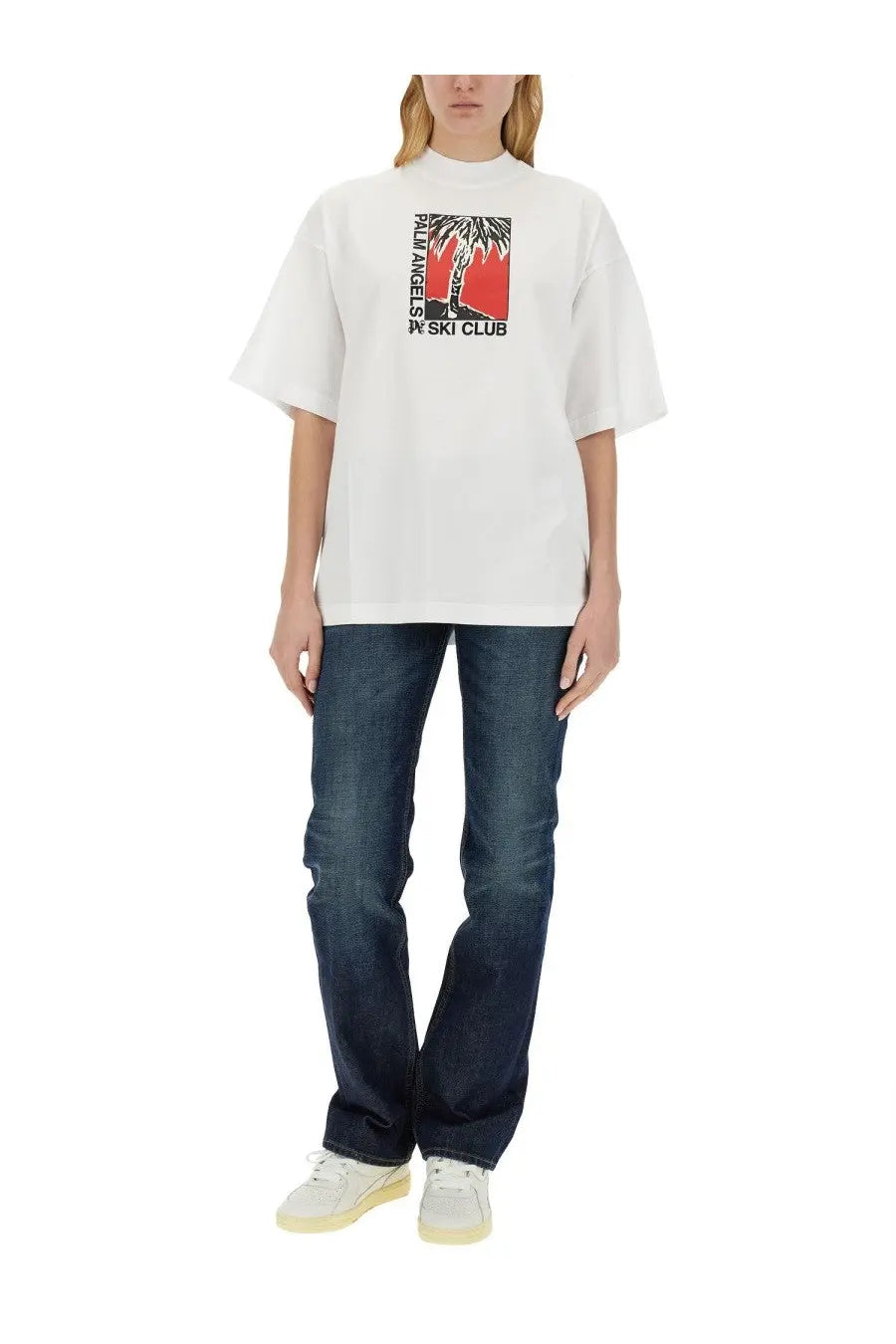 White oversized cotton t-shirt featuring bold red and black palm tree graphic with palm angels ski club text