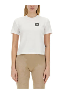White short-sleeved cotton t-shirt with black rectangular palm angels logo patch on the chest for women