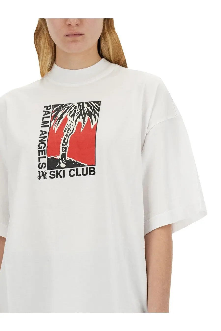 White palm angels women’s t-shirt with bold black and red palm tree graphic and palm angels ski club text