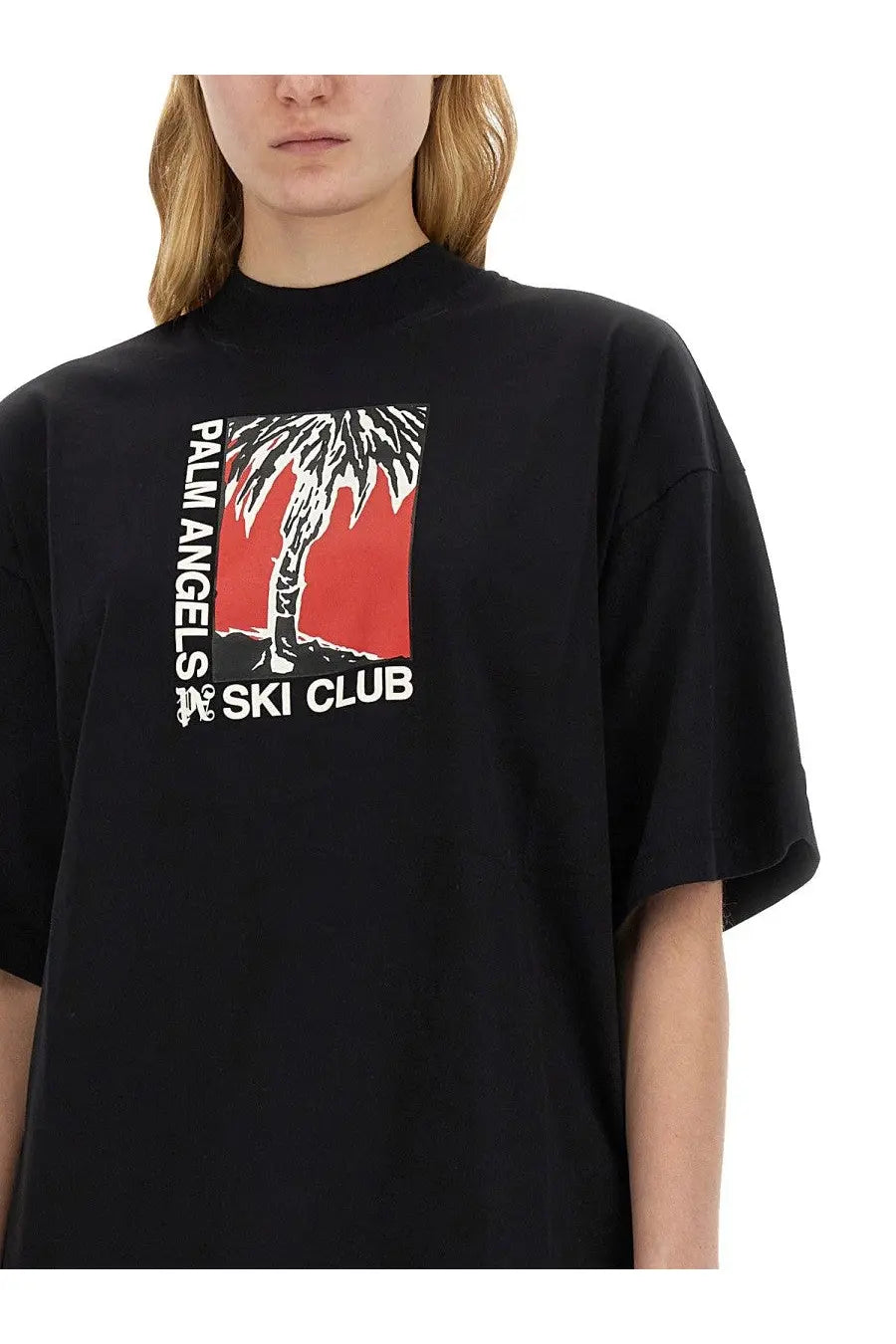 Black oversized palm angels women’s soft fit t-shirt with bold red palm tree graphic and ski club text in white