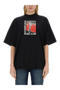 Black oversized palm angels women soft fit t-shirt with bold red palm tree graphic and ski club text in white