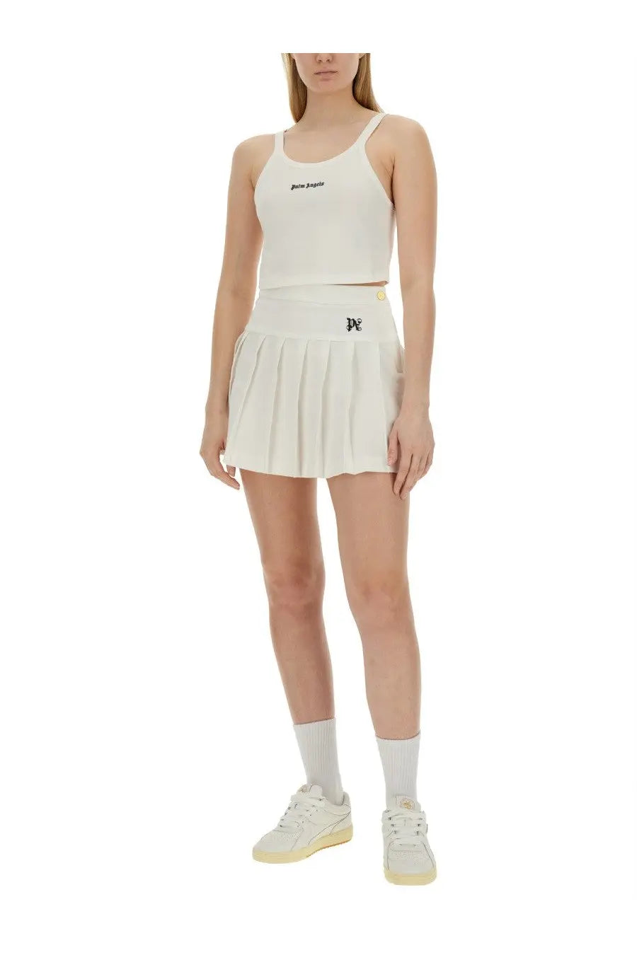 White pleated tennis skirt with black logo detail paired with palm angels women’s tank top white for sporty style