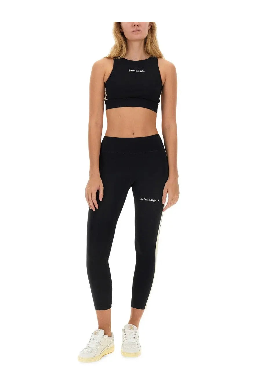 Black palm angels women’s crop top and leggings set with white logo branding for casual and athletic wear