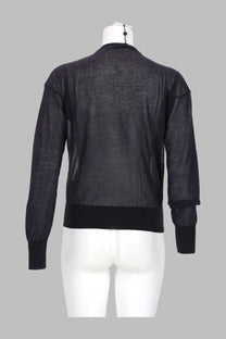 Black sheer mesh bomber jacket with ribbed cuffs and hem shown from the back in Paloma Wool women’s cardigan Paige Blue